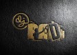 A textured black surface featuring a golden logo with the letters "D","J", “B”,”A”,”D”, 